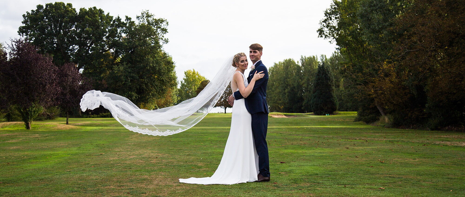 Newly married couple in the parkland at Trentham Park
